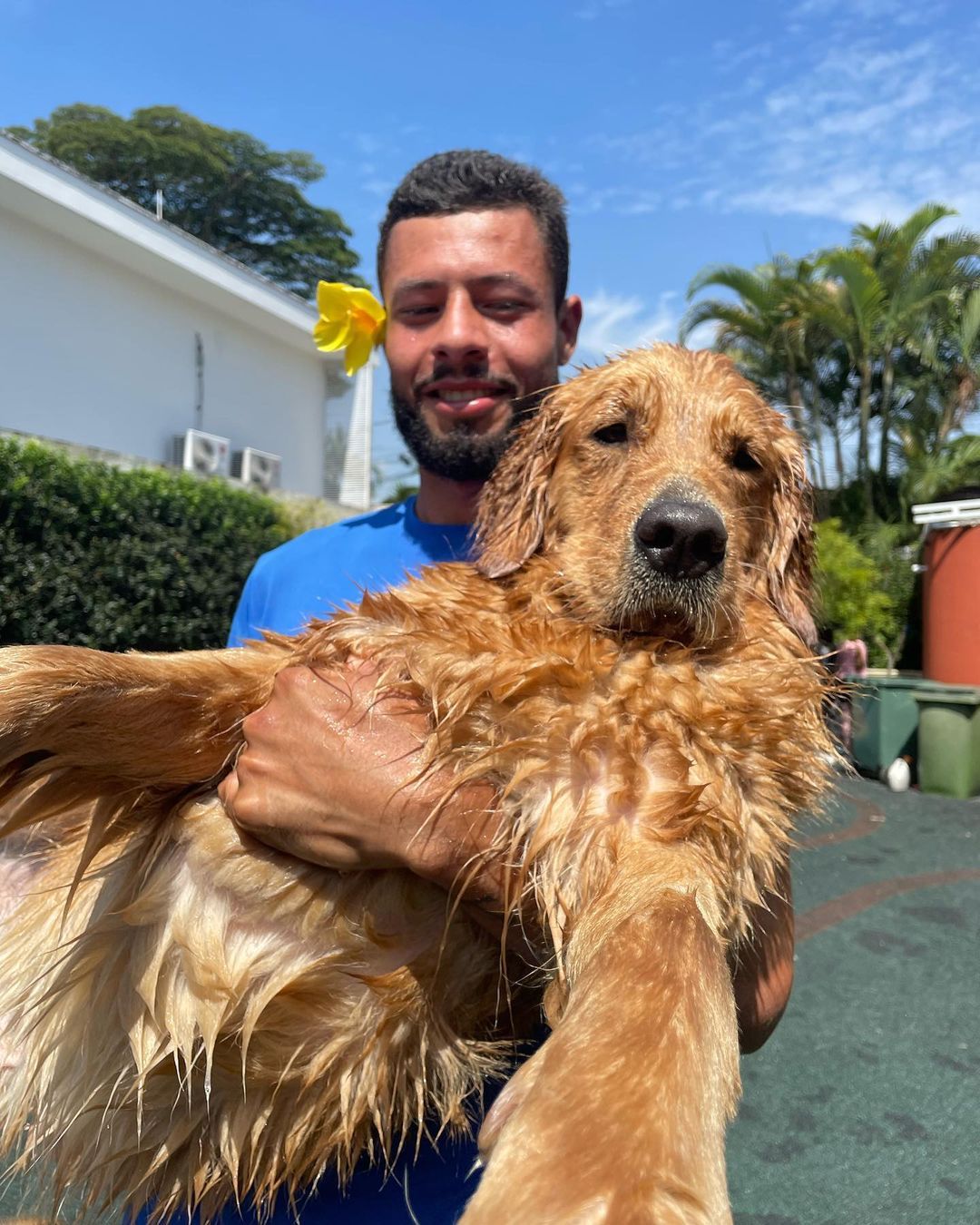 Happy family with their retriever puppy